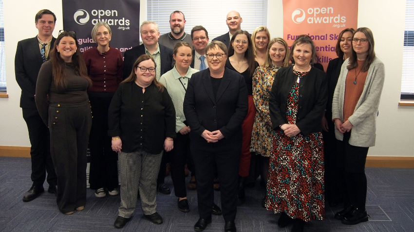 Maria Eagle MP with Open Awards staff celebrating the organisation’s 45th anniversary at its Liverpool office.