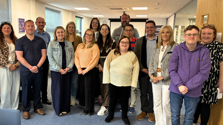 Open Awards team members gathered in the office for a staff group photograph.